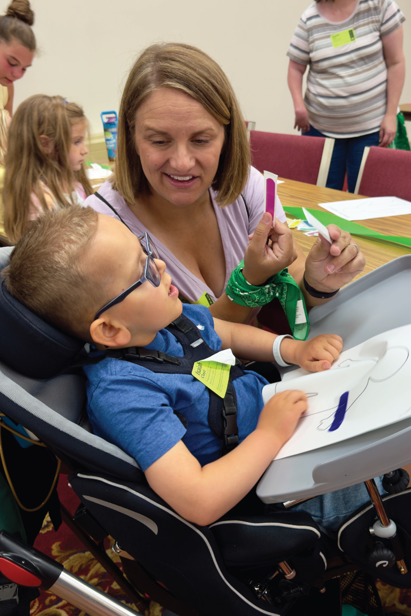 A volunteer serving as a one-to-one buddy for a child.